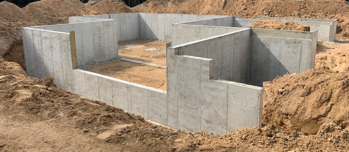 1400 sq ft poured foundation with daylight wall and custom flatwork porch in Kalamazoo County Michigan