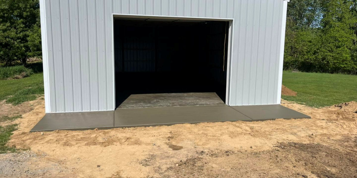Pole barn with newly poured concrete flooring and apron